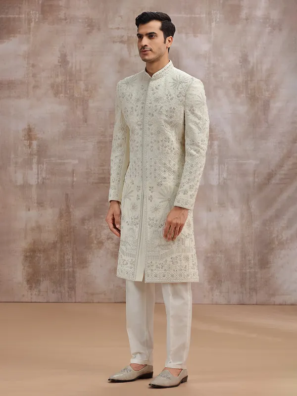 Cream silk wedding sherwani with cutdana embellishment
