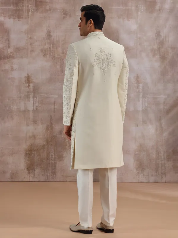 Cream silk wedding sherwani with cutdana embellishment