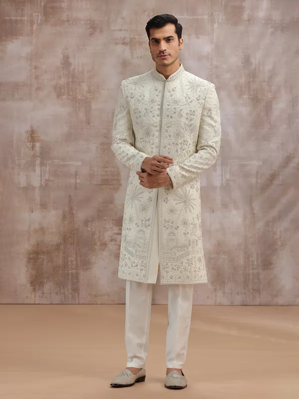 Cream silk wedding sherwani with cutdana embellishment