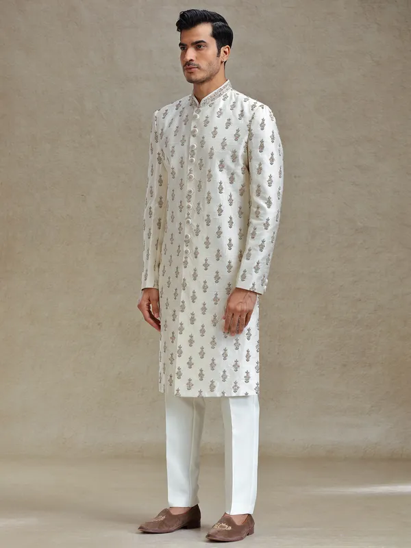 Cream  silk wedding style long jacket sherwani set