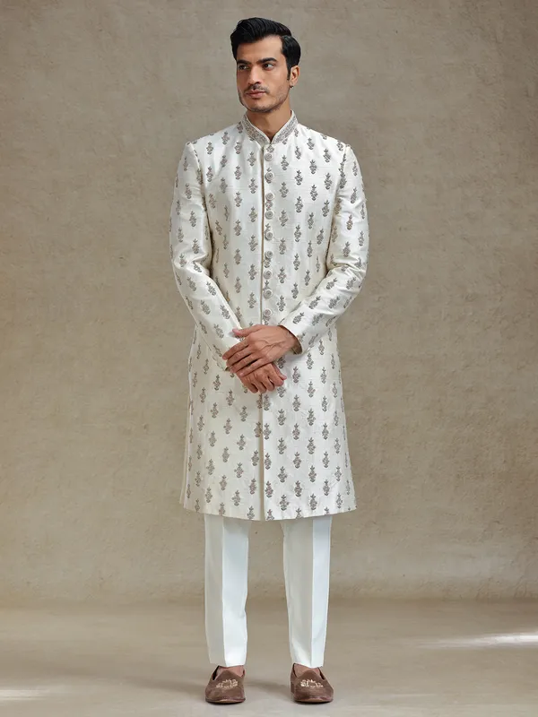 Cream  silk wedding style long jacket sherwani set