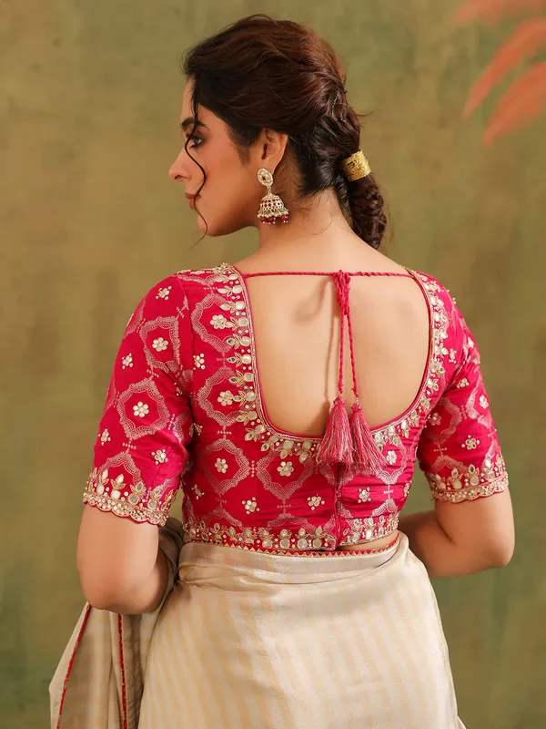 Cream silk zari worked saree with red blouse wedding look