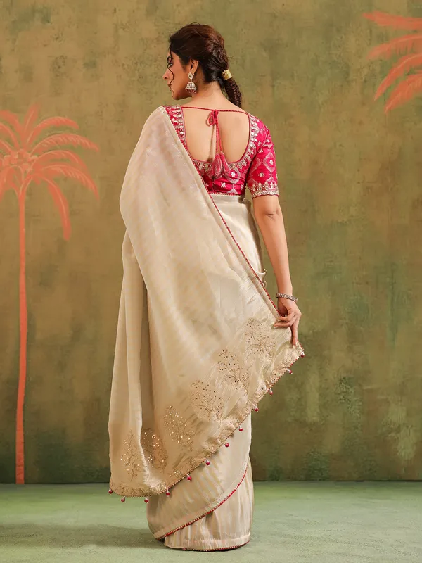 Cream silk zari worked saree with red blouse wedding look