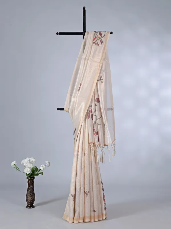 Cream tissue cotton silk saree with sequins and embroidery detailing