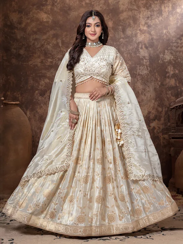 Cream tissue silk lehenga choli with beads work