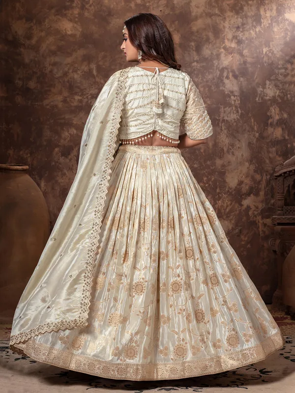 Cream tissue silk lehenga choli with beads work