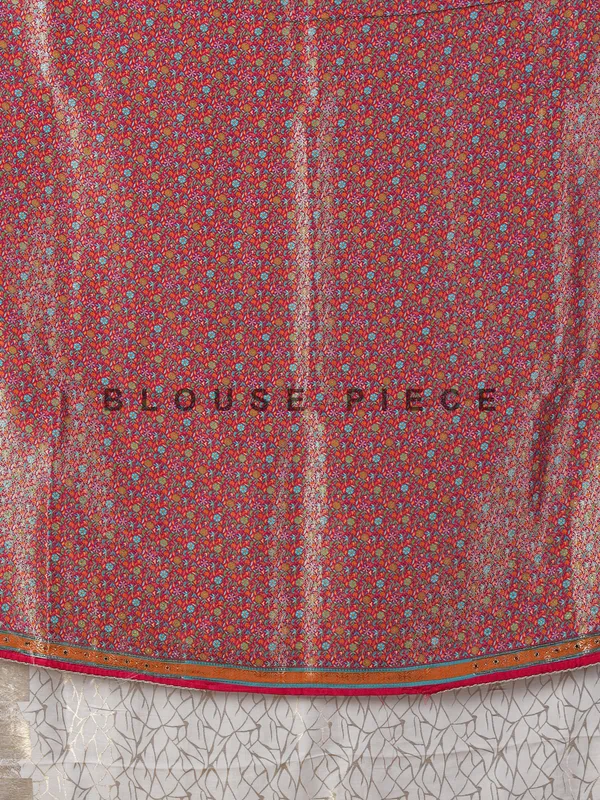 Cream tissue silk saree with colorful motifs embellishments