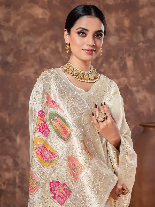 Cream tissue silk wedding wear saree
