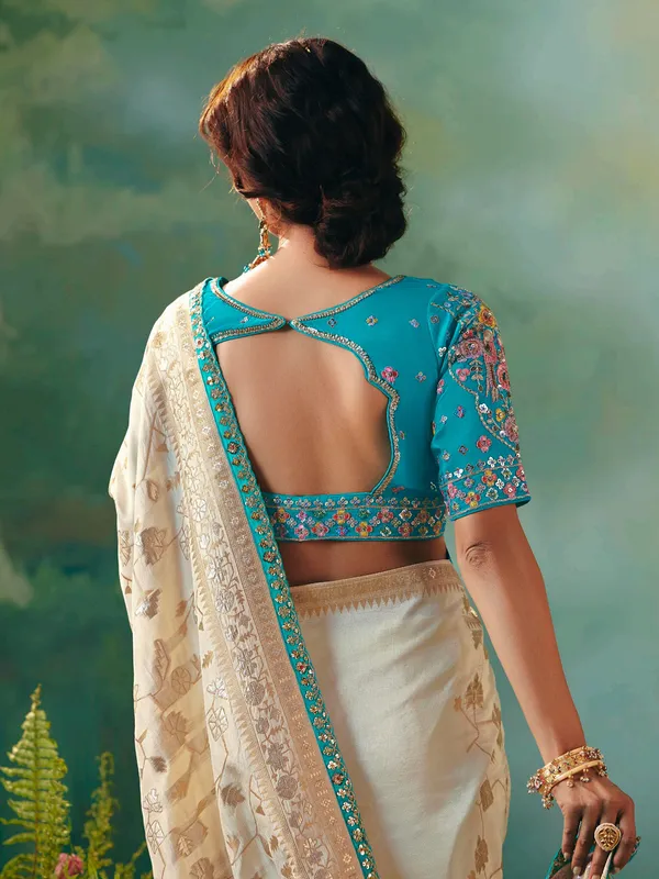 Cream viscose dola silk saree with zari work