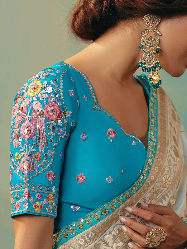 Cream viscose dola silk saree with zari work