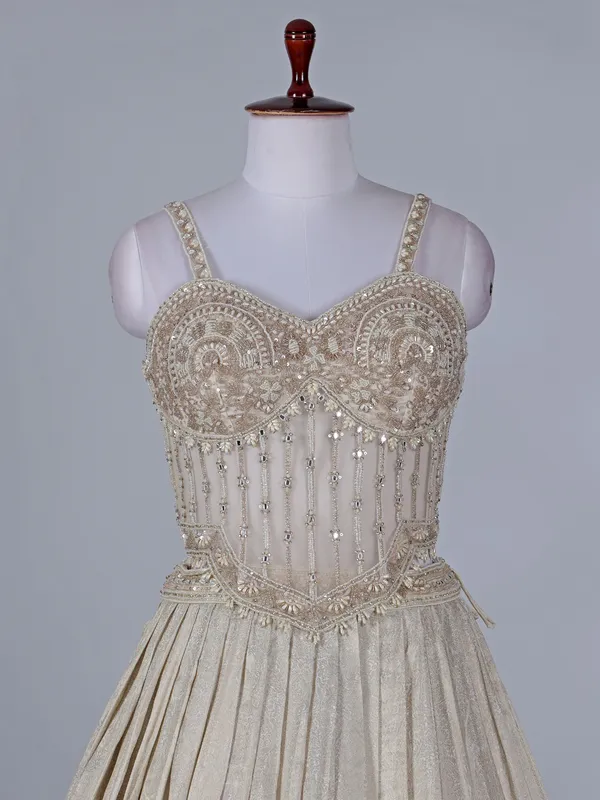 Cream wedding wear lehenga choli in brocade silk