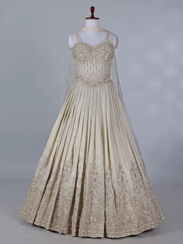 Cream wedding wear lehenga choli in brocade silk