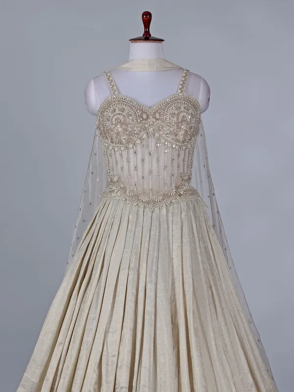 Cream wedding wear lehenga choli in brocade silk