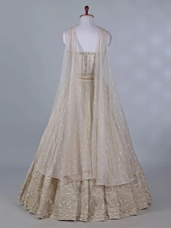 Cream wedding wear lehenga choli in brocade silk