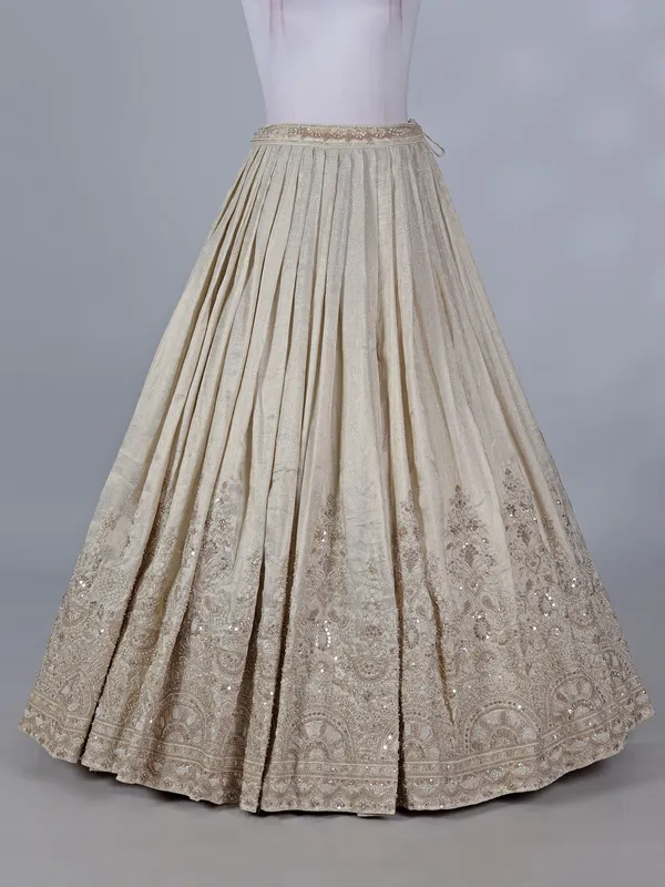 Cream wedding wear lehenga choli in brocade silk