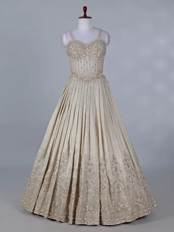 Cream wedding wear lehenga choli in brocade silk