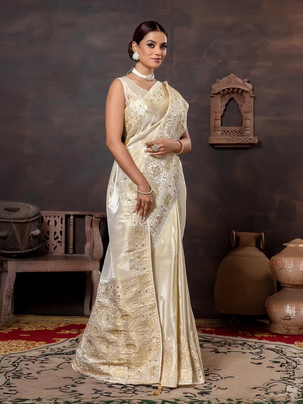 Cream wedding wear saree in rich dola silk