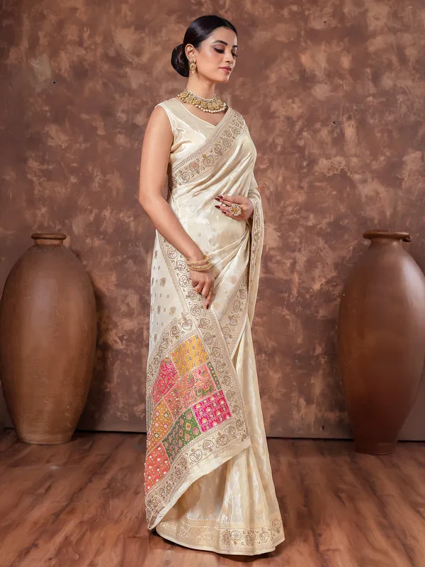 Cream wedding wear saree in tissue silk