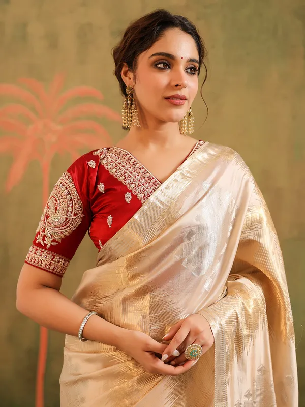 Cream wedding wear silk saree with bold red bloues