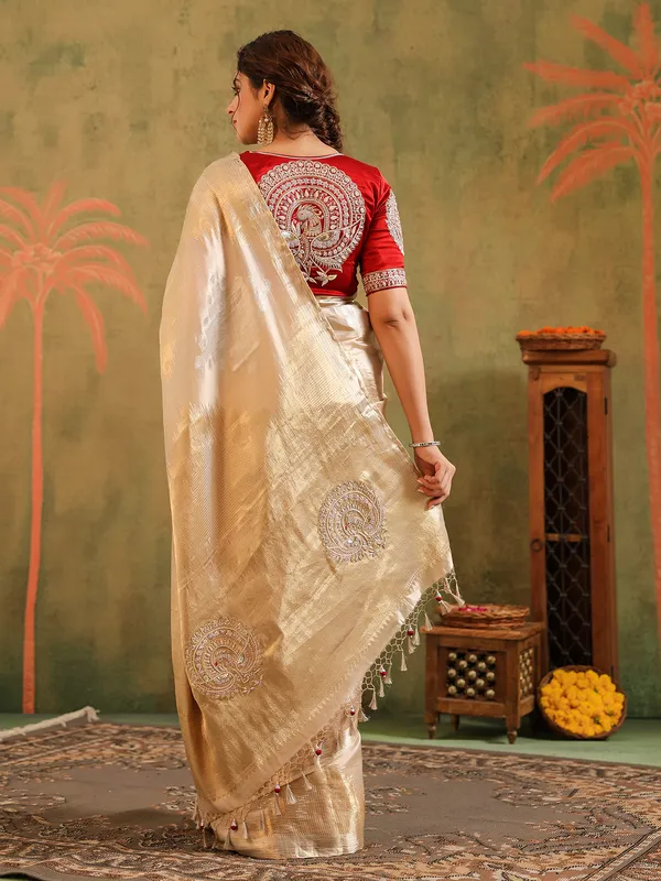 Cream wedding wear silk saree with bold red bloues