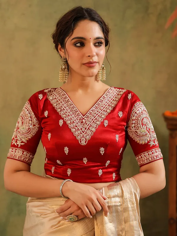 Cream wedding wear silk saree with bold red bloues
