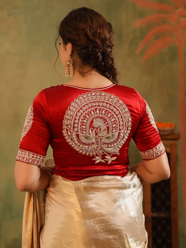 Cream wedding wear silk saree with bold red bloues