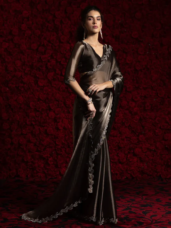 Dark brown chiffon saree with stone embellishment
