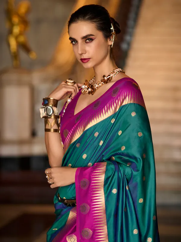 Dark green banarasi silk saree with pink border
