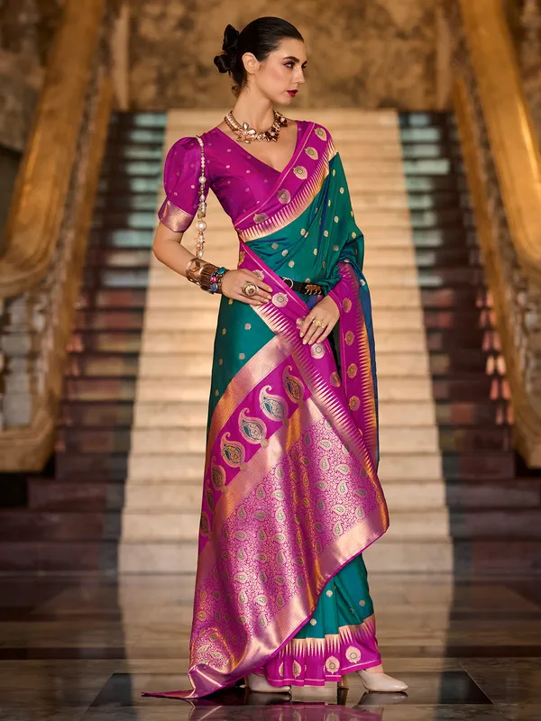 Dark green banarasi silk saree with pink border