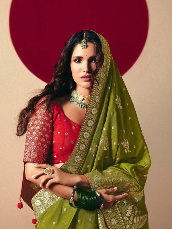 Dark green dola silk zari weaving saree