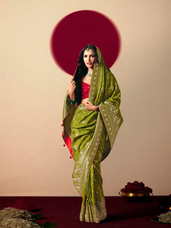 Dark green dola silk zari weaving saree