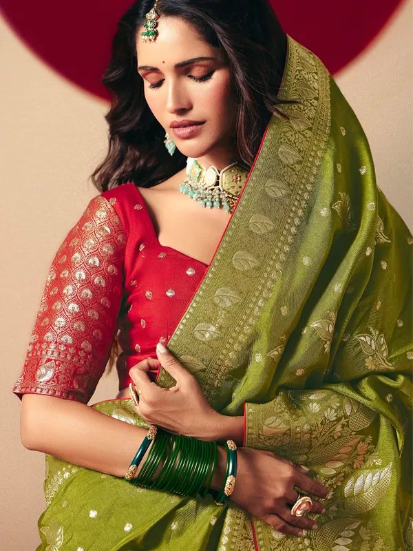 Dark green dola silk zari weaving saree