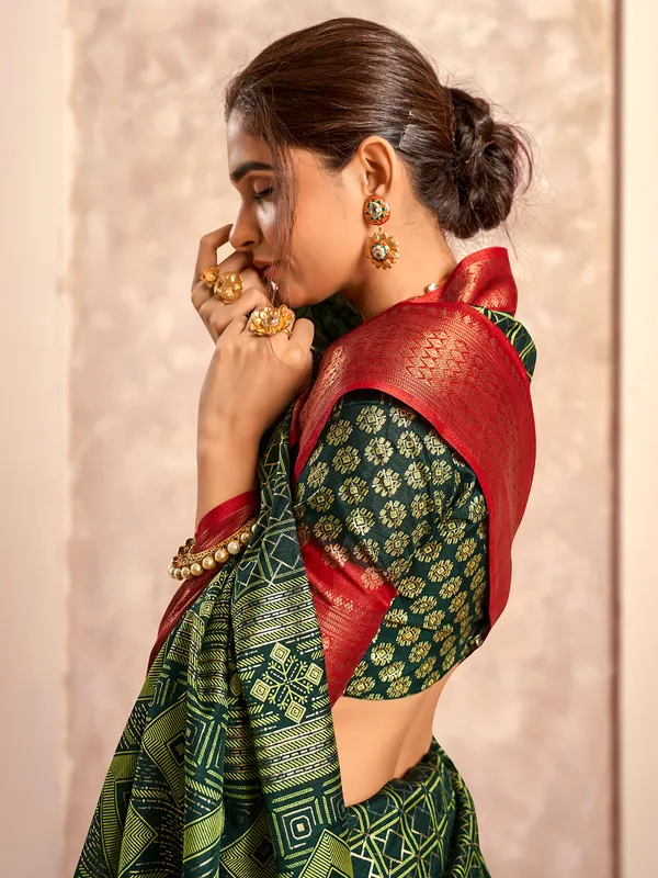Dark green dola silk zari worked saree