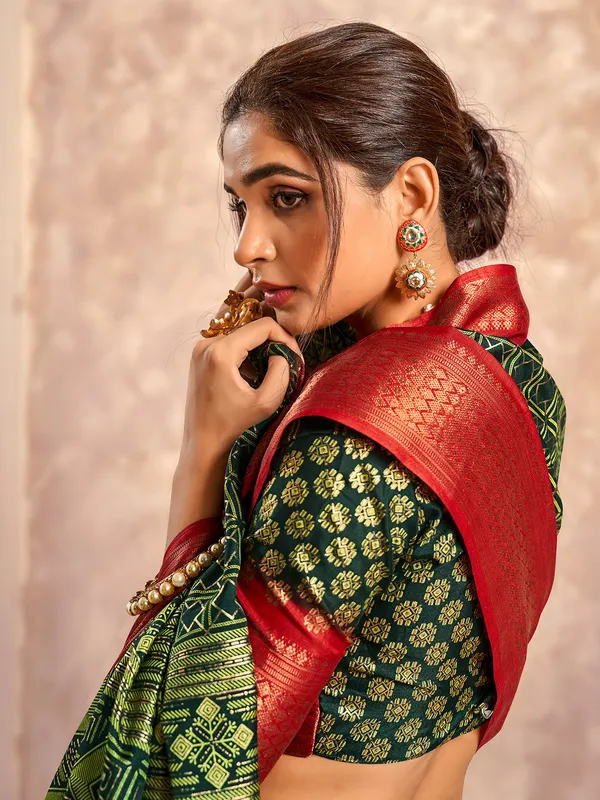 Dark green dola silk zari worked saree
