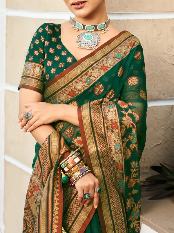Dark green festive georgette saree