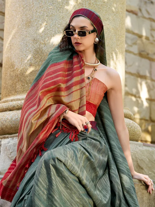 Dark green red silk saree with zari weaving