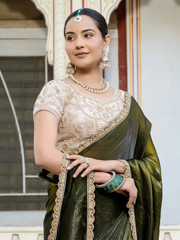 Dark green satin silk saree with embellished elegance