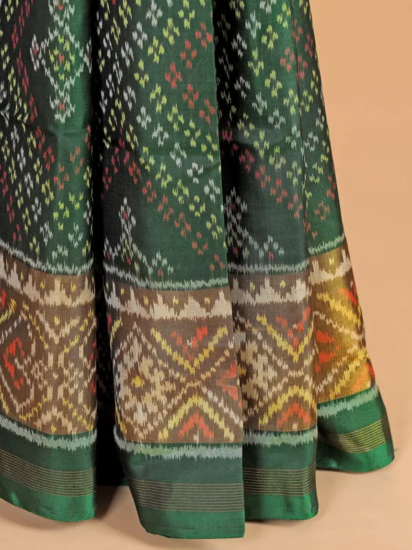 Dark green patola silk saree