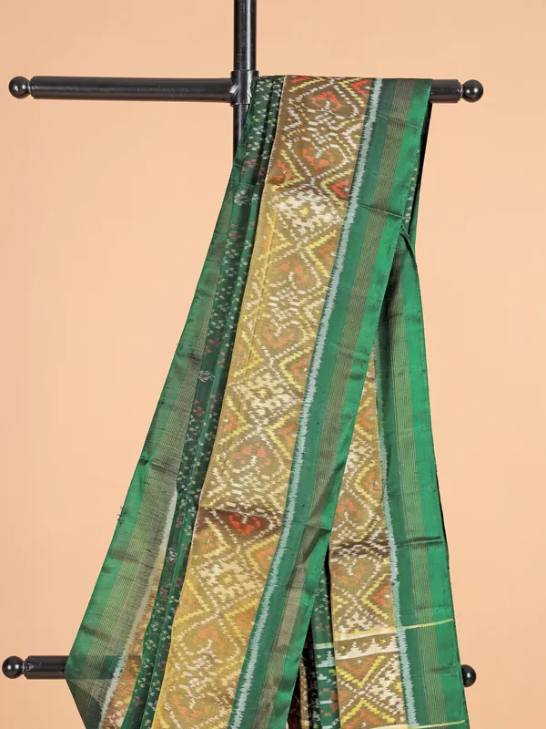 Dark green patola silk saree