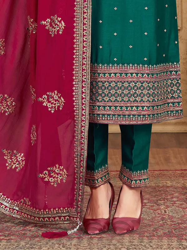 Dark green silk salwar suit with maroon dupatta
