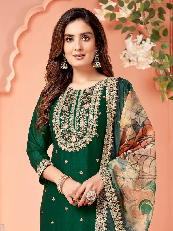 Dark green silk salwar suit with printed dupatta