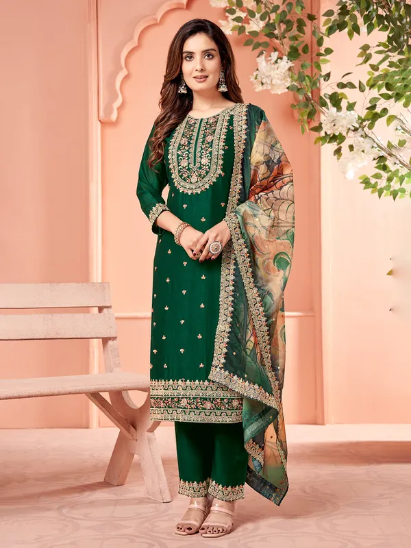 Dark green silk salwar suit with printed dupatta