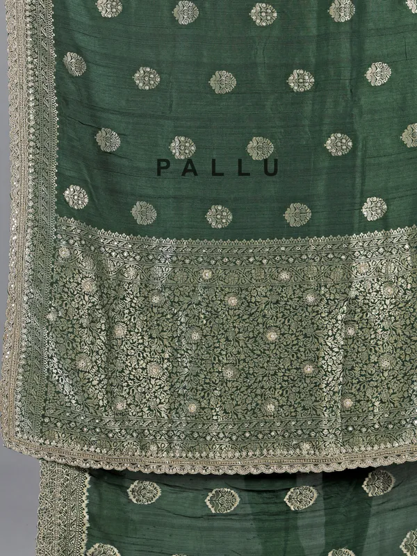 Dark green silk saree with heavy work blouse