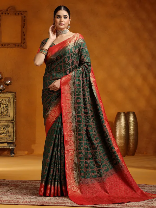 Dark green silk saree with red border