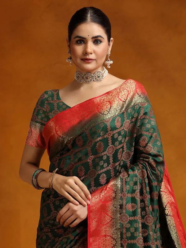 Dark green silk saree with red border