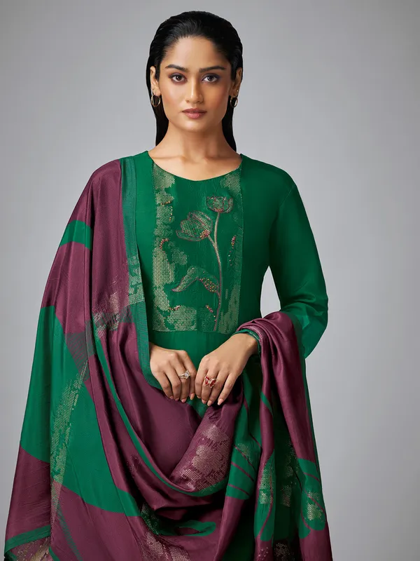 Dark green silk thread worked salwar suit