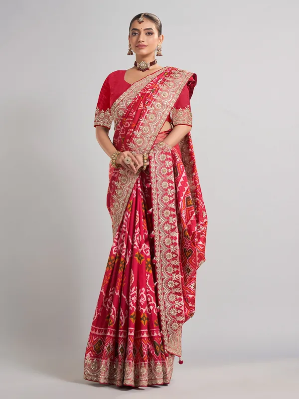 Deep rani pink patola silk saree for bridal festivities