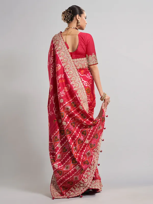 Deep rani pink patola silk saree for bridal festivities