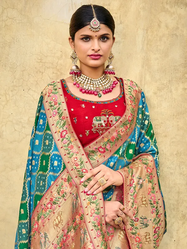 Dola silk turquoise blue wedding wear in printed
