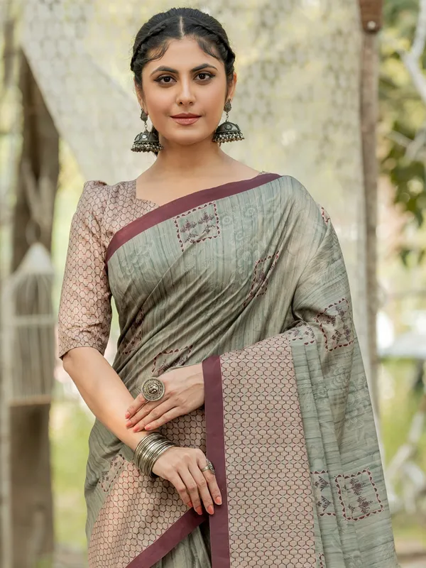 Dusty pista green printed kozi silk saree